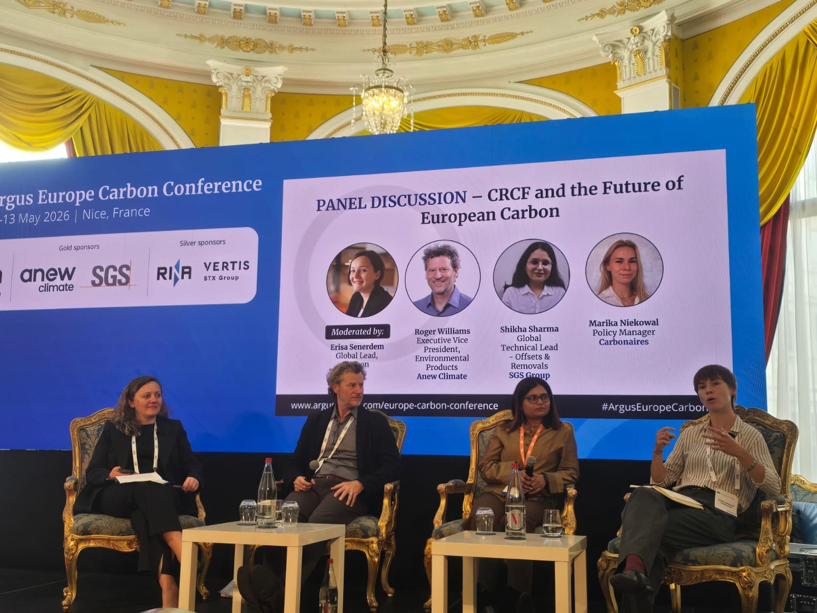 Panel discussion titled "CRCF and the Future of European Carbon" at the Argus Europe Carbon Conference 2026, with Carbonaires Policy Manager Marika Niekowal speaking on the right, alongside Erisa Senerdem (Argus Media, moderator), Roger Williams (Anew Climate) and Shikha Sharma (SGS Group)