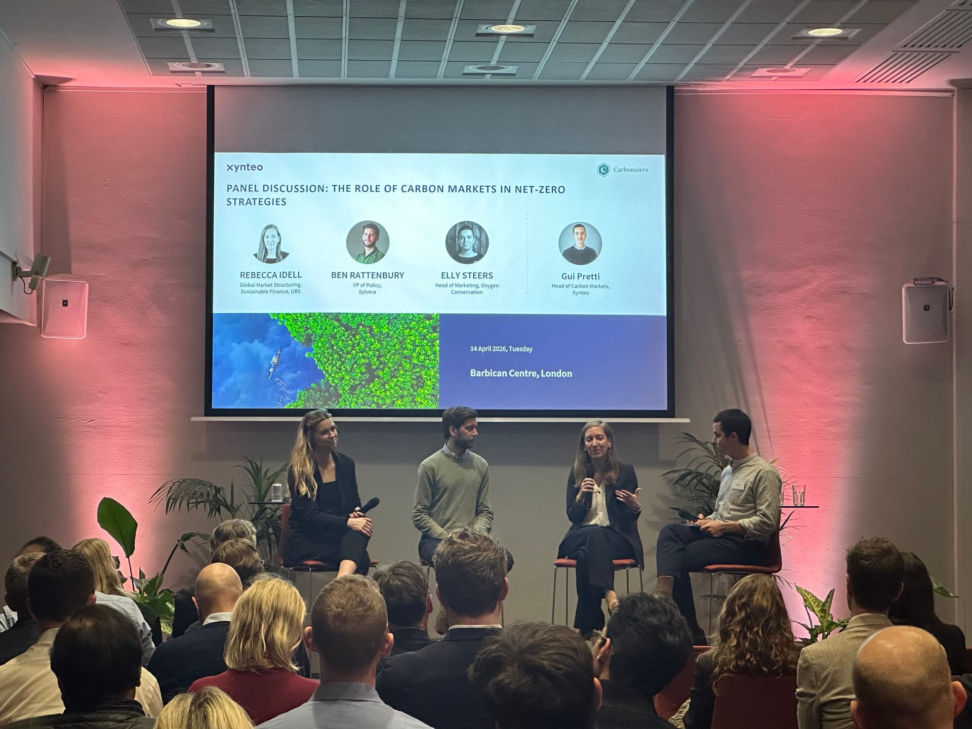 Panel discussion on the role of carbon markets in net-zero strategies at the Carbonaires and Xynteo event at the Barbican, London, with Rebecca Idell, Ben Rattenbury, Elly Steers and Guilherme Pretti on stage
