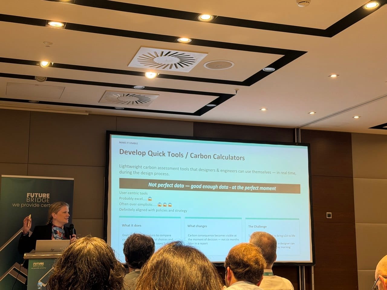 Speaker presenting on developing quick tools and carbon calculators at the Scope 3 Summit, with a slide emphasising not perfect data but good enough data at the perfect moment